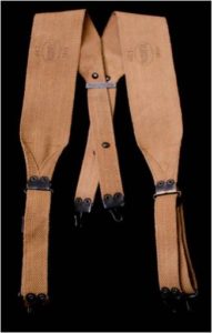 Model 1910 suspenders were used to hold up and distribute the weight of the cartridge belt. The hooks on the ends of the straps fit into the grommets on the belt. Marked Oct./Russell/1918.