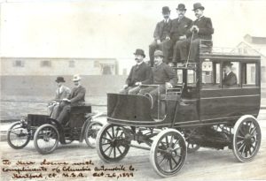 Visiting German Businessmen Driving Electric Omnibus