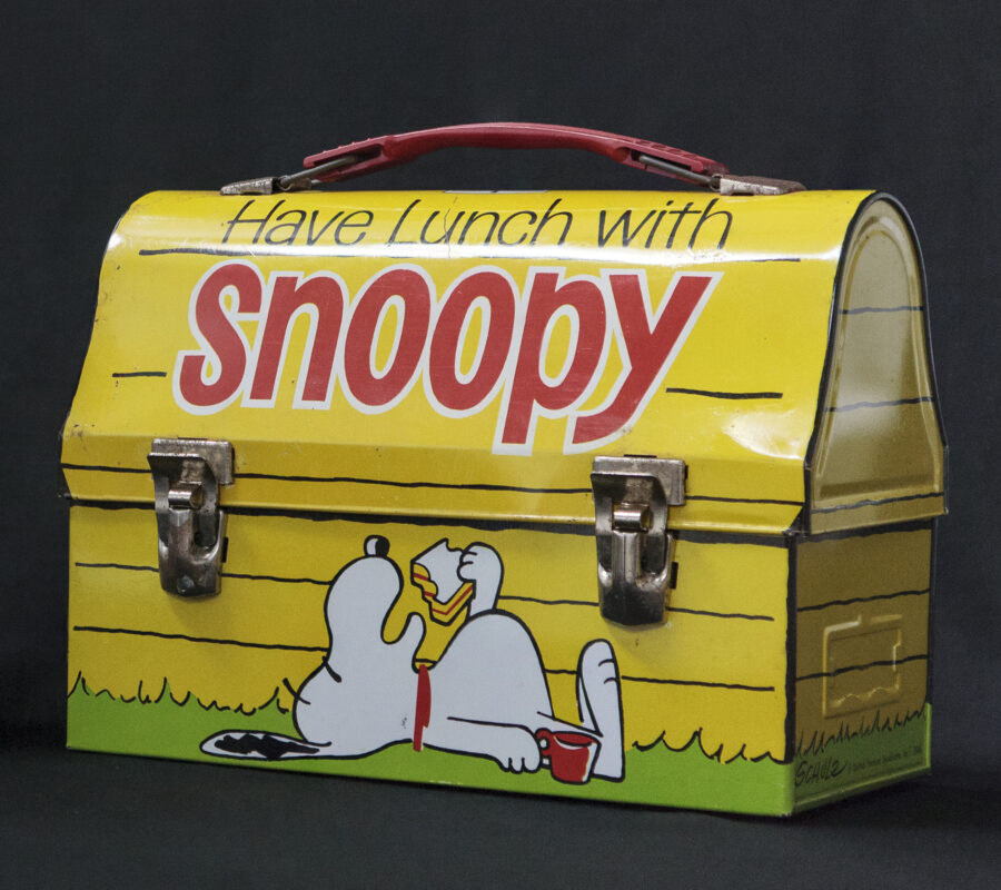 Metal Lunch Box with an image of Snoopy on the Outside.